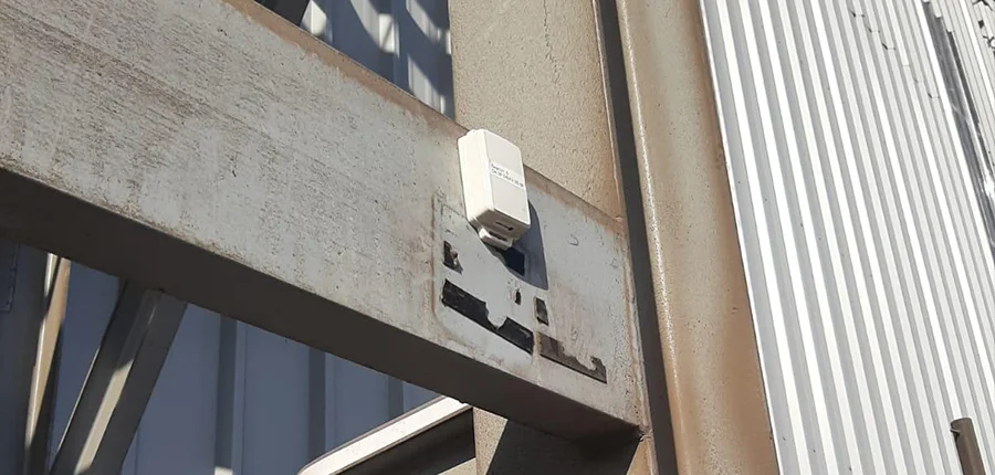 M3 Mini Asset Tag mounted on metal structure in industrial facility
