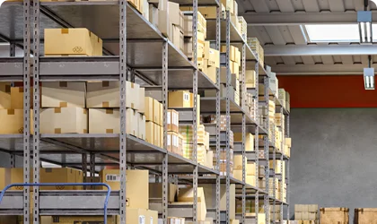 Industrial warehouse with organized shelving systems and cardboard boxes