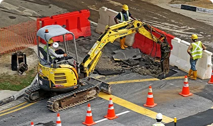 Excavator at a roadwork site showing hazardous zone geofencing applications.