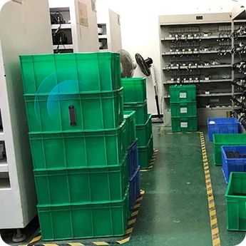 M11 pallet tracker attached to a plastic tote bin for asset tracking on a factory production floor