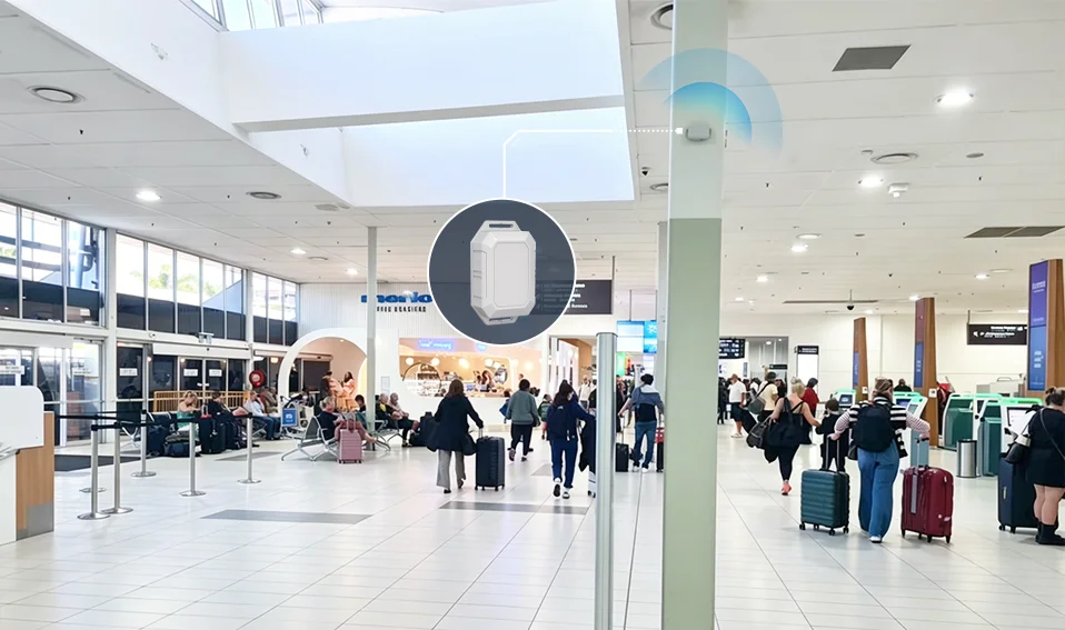 MOKO M3 Bluetooth beacon installed on an airport terminal pillar broadcasting signals to passengers in a busy concourse.