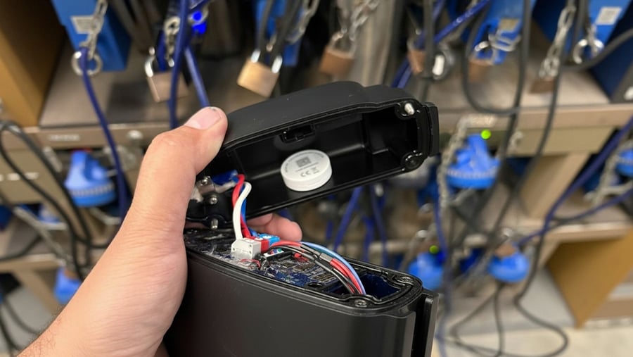 M1 Bluetooth coin tag inserted inside a mining headlamp for personnel tracking