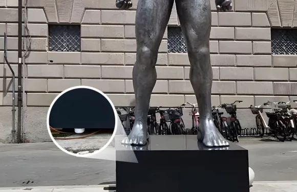 BLE beacon installation at outdoor Italian statue exhibition showing wireless point-of-interest technology for museum visitor engagement